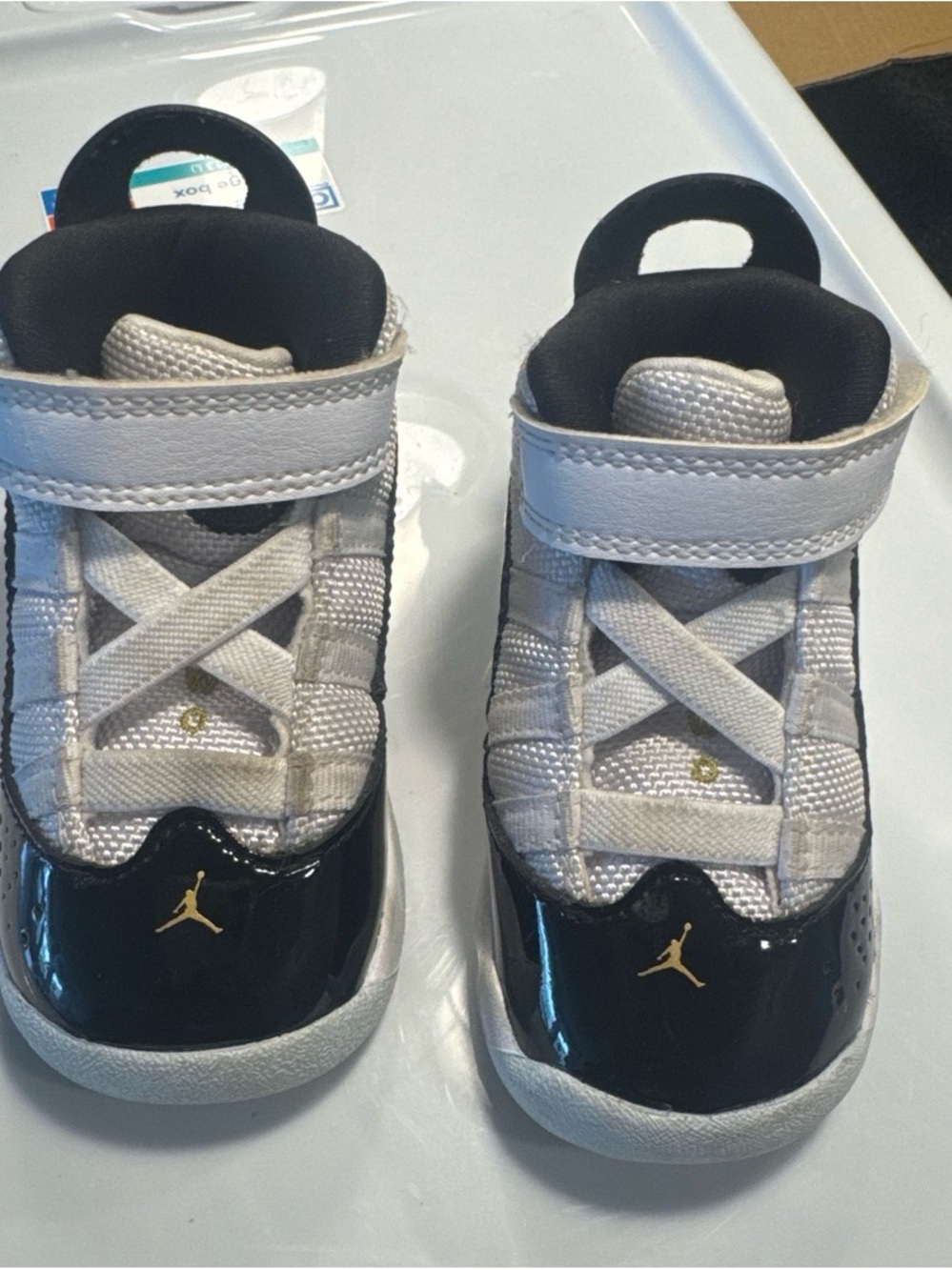 Jordan Kids' White and Black High-Top Sneakers with Gold Jumpman